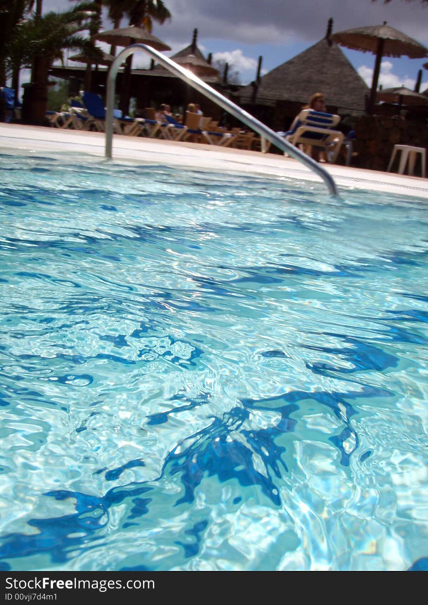 Sunny pool with blue water. Sunny pool with blue water