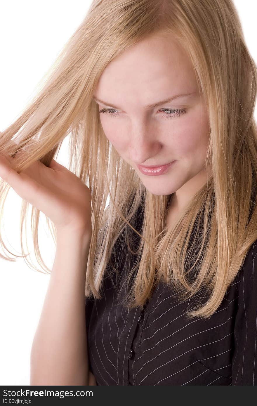 Young woman running througt her hair with fingers