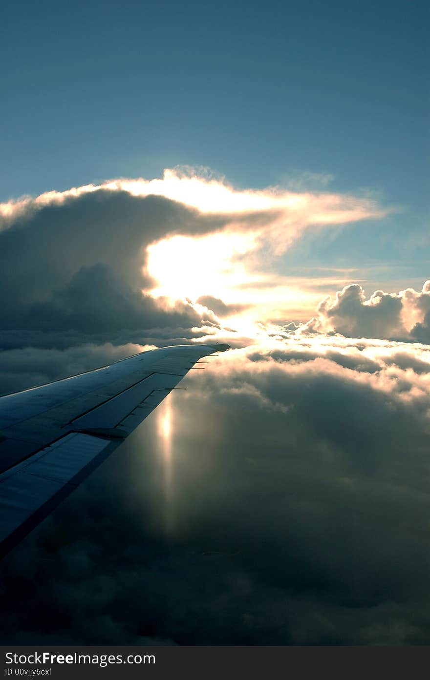 The sun behind clouds from a plane. The sun behind clouds from a plane