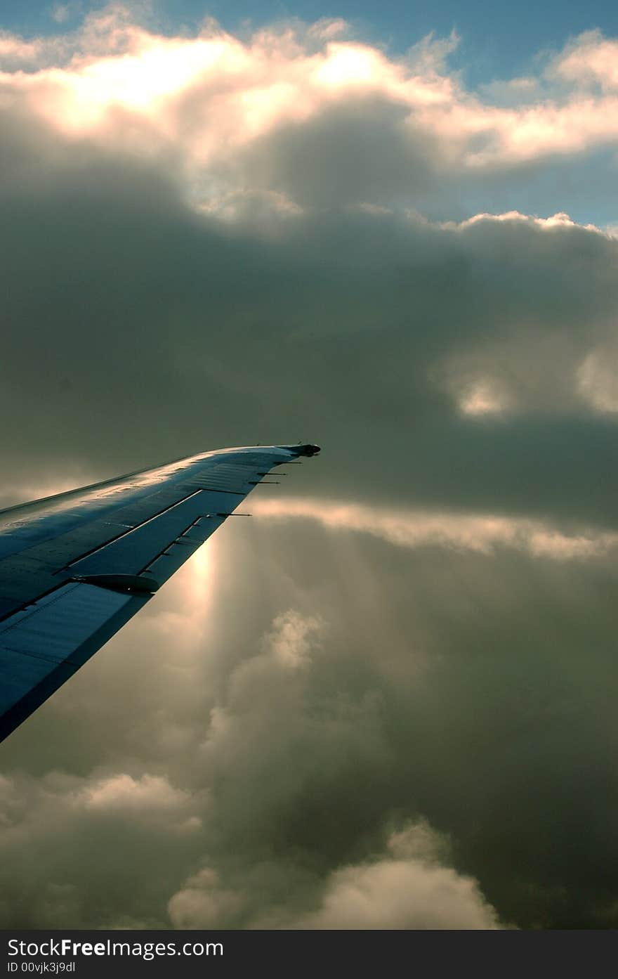 The sun behind clouds from a plane. The sun behind clouds from a plane