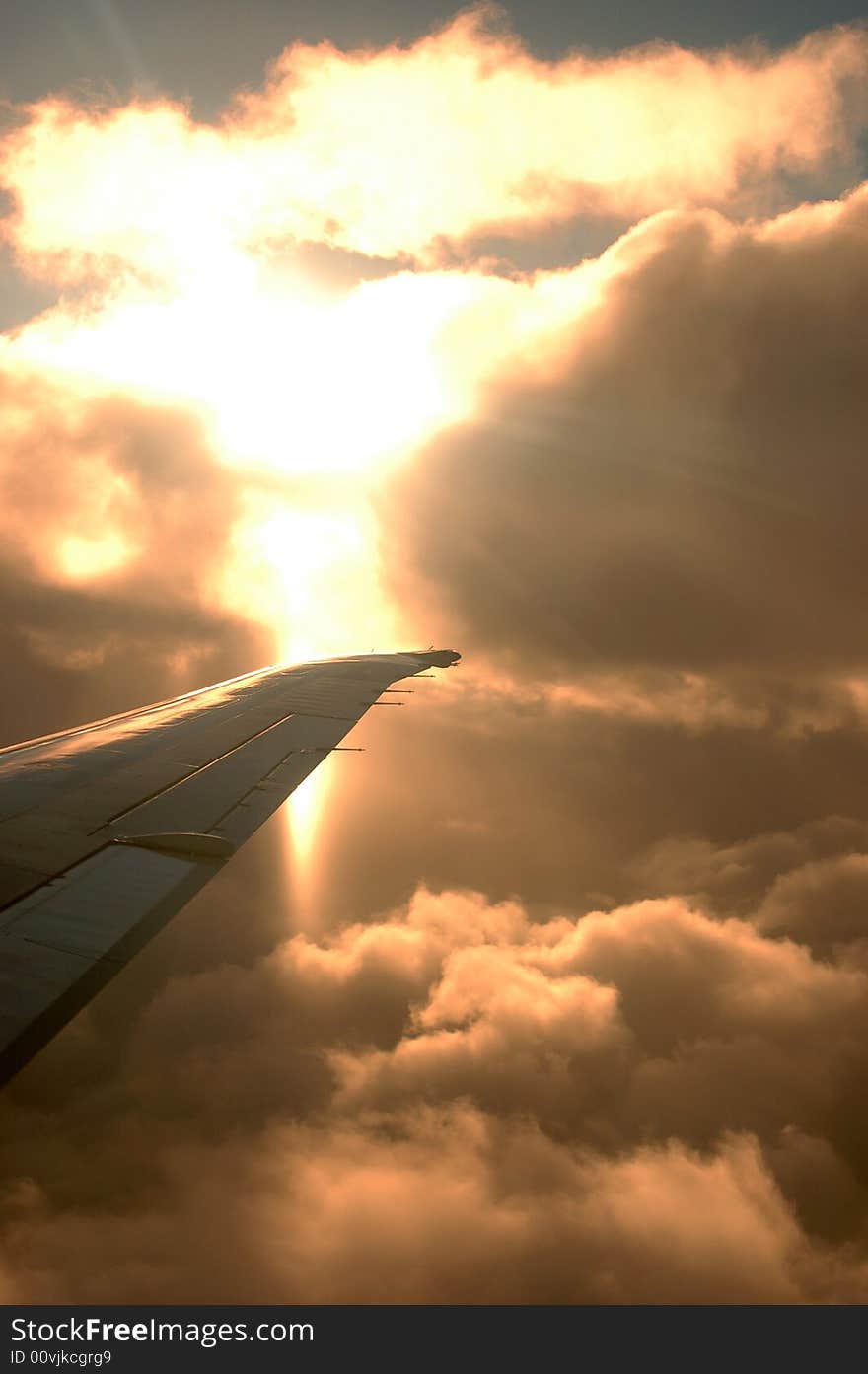 The sun behind clouds from a plane. The sun behind clouds from a plane