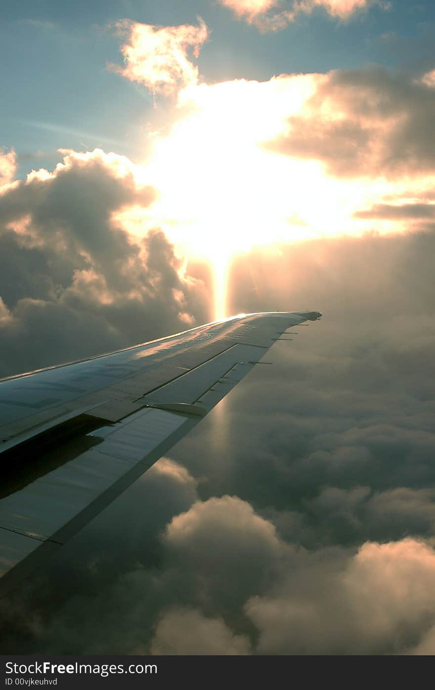 The sun behind clouds from a plane. The sun behind clouds from a plane