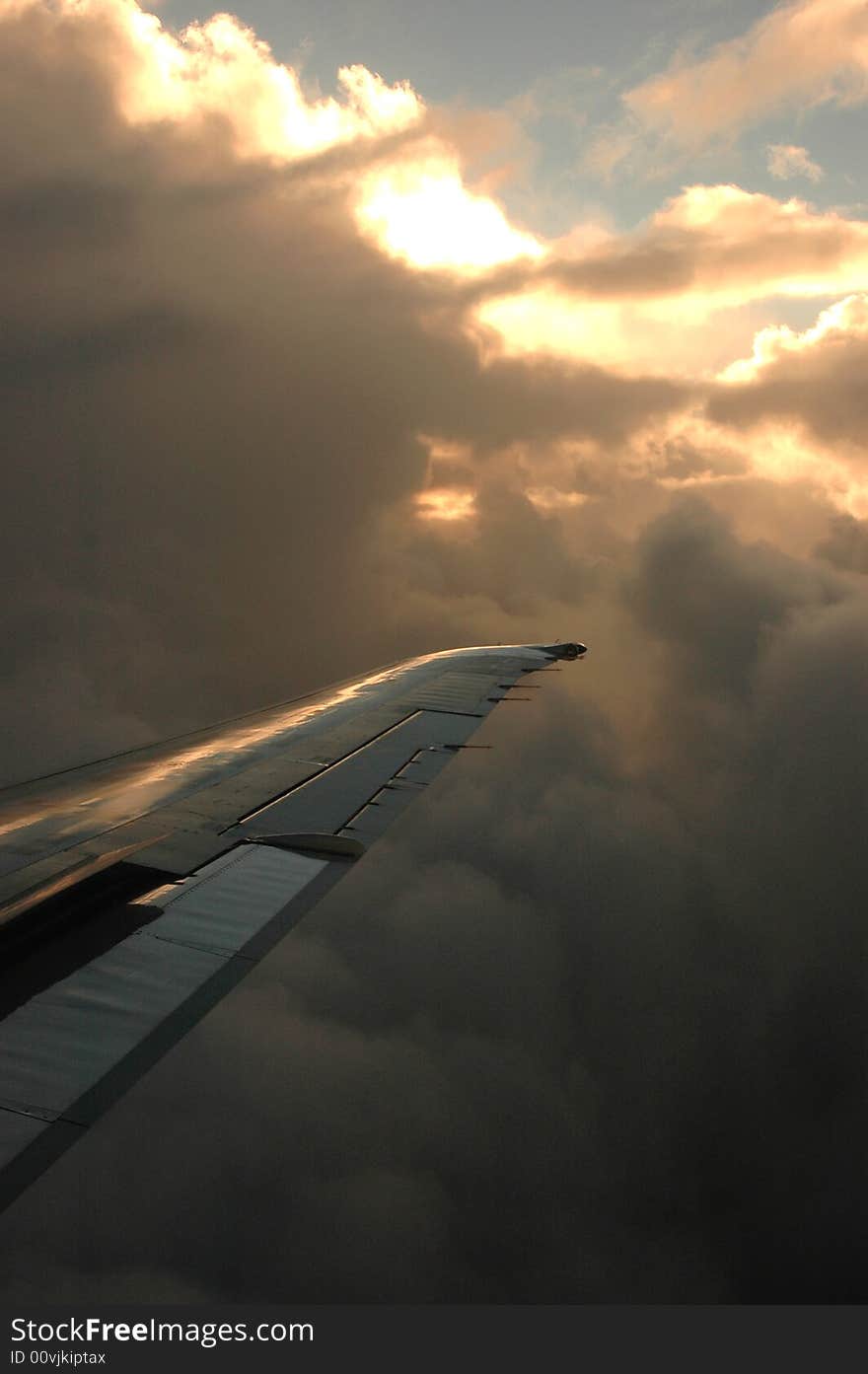 The sun behind clouds from a plane. The sun behind clouds from a plane