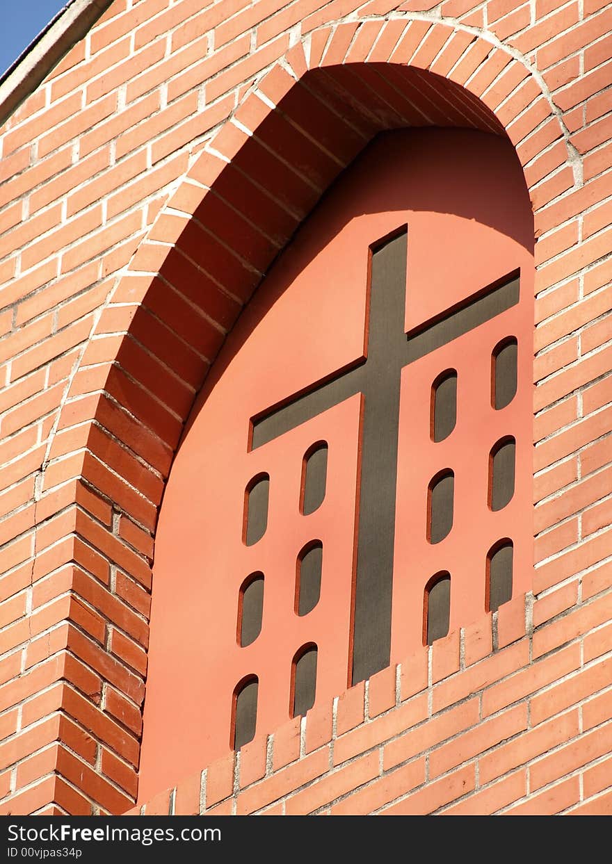 Church Cross in red brick Window Arch. Church Cross in red brick Window Arch