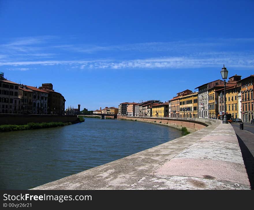 The Riverwalk (Lungarno) along the Arno River in Pisa Italy. The Riverwalk (Lungarno) along the Arno River in Pisa Italy