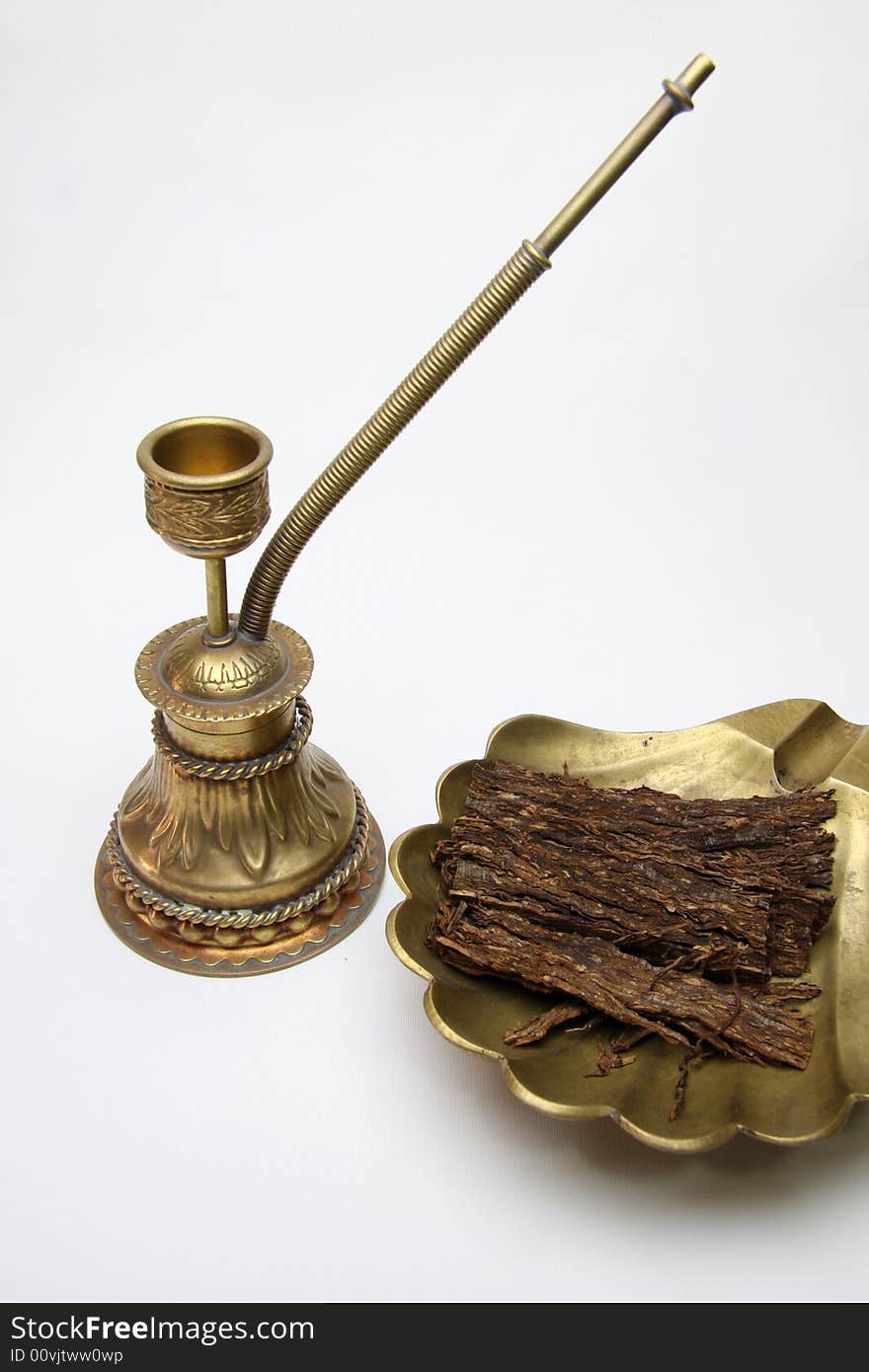 My old tobacco pipe and tobacco isolated on white.