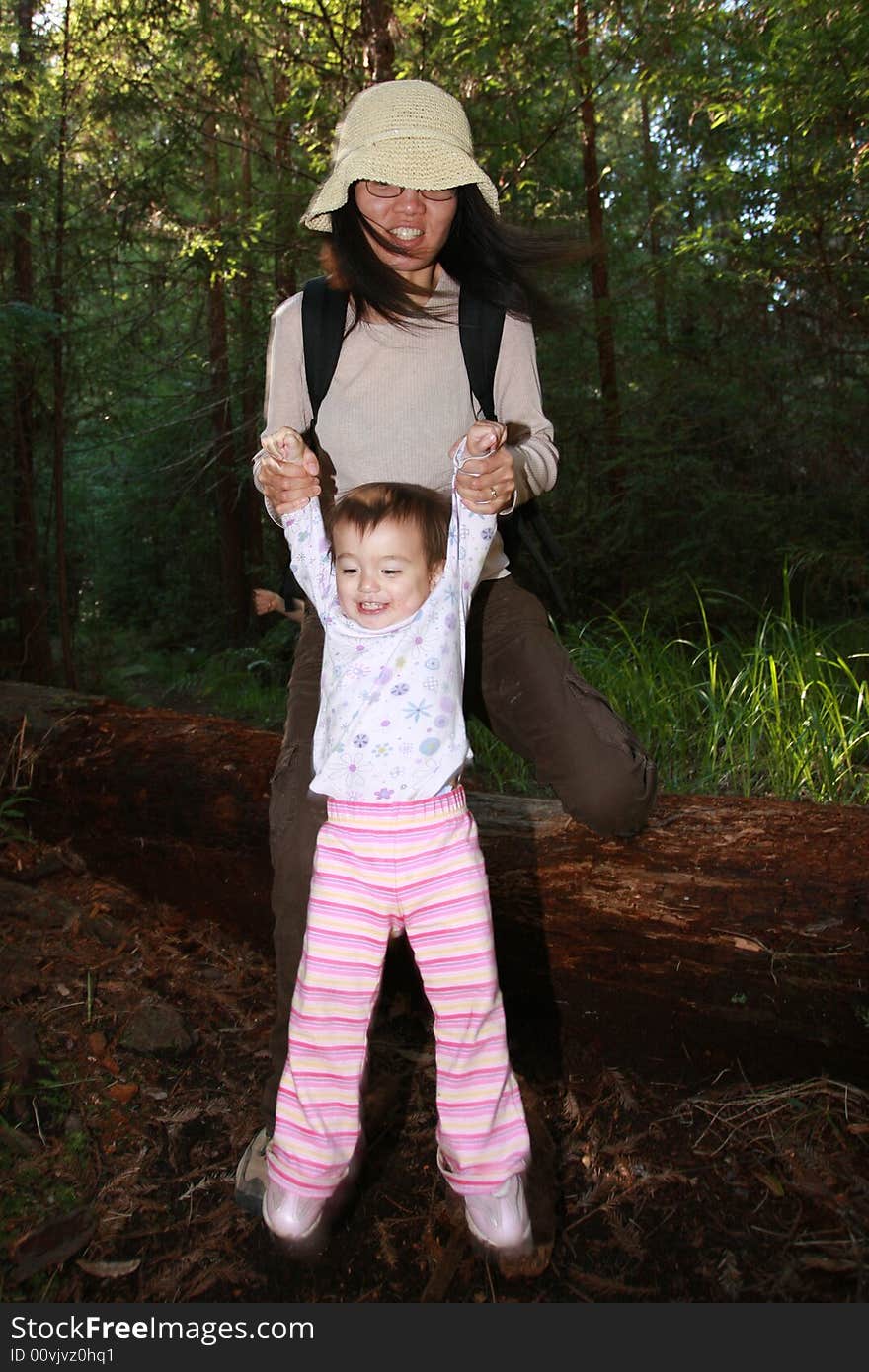 Baby girl first steps in the forest