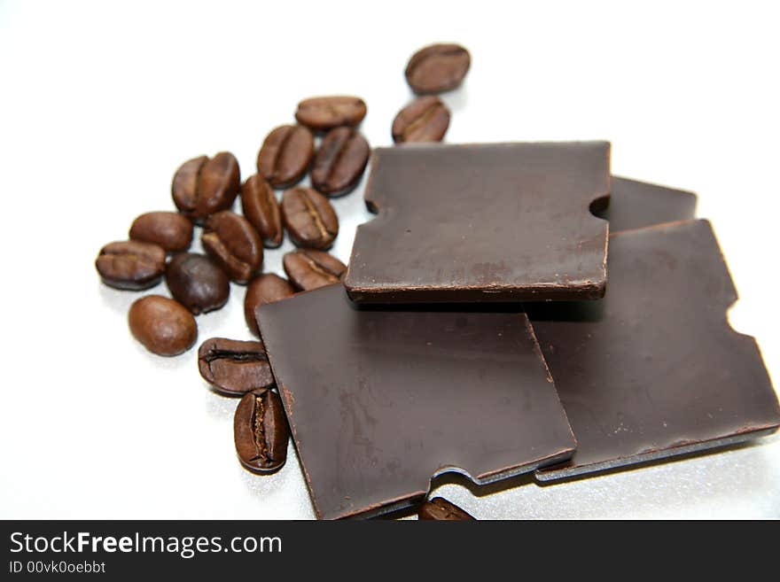 Coffee grains and slices of chocolate. Coffee grains and slices of chocolate