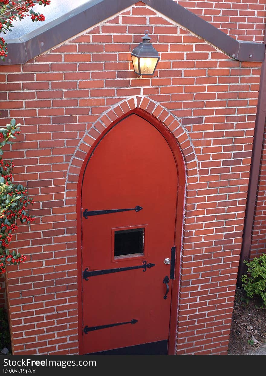 Red Brick Arch Door with light over head. Red Brick Arch Door with light over head