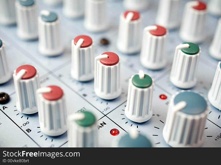 Closeup macro detail of a studio mixing console. Closeup macro detail of a studio mixing console