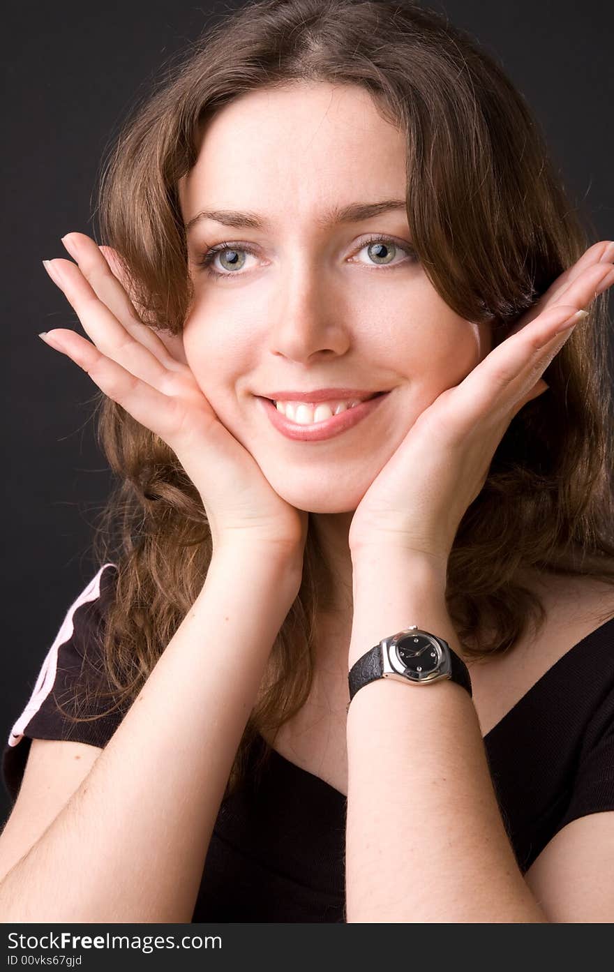 The beautiful girl in studio on a black background.