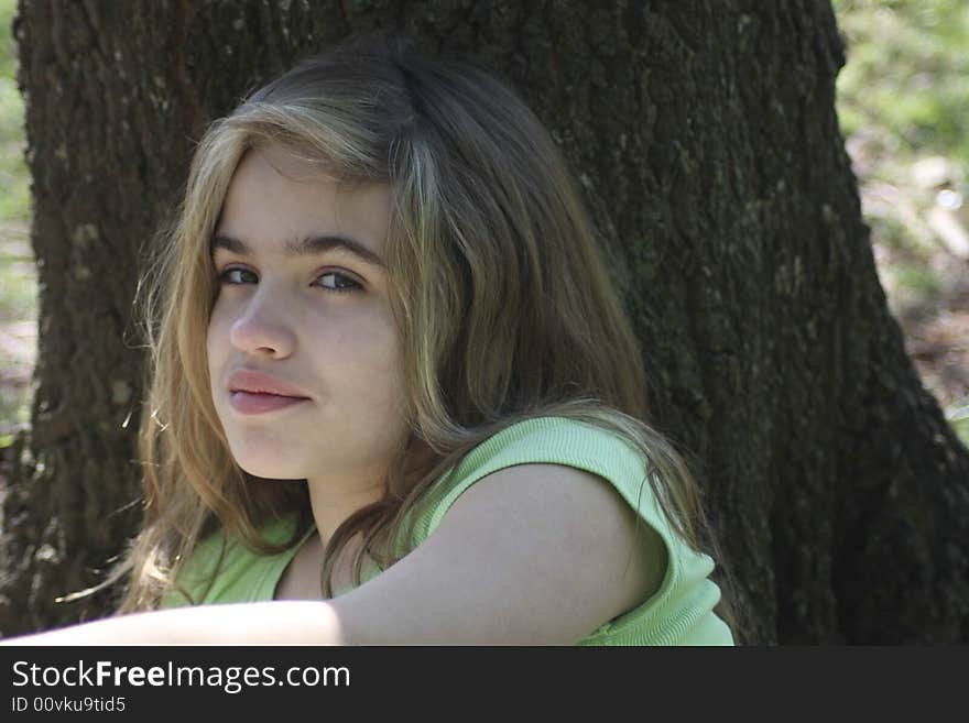 Girl Against Tree