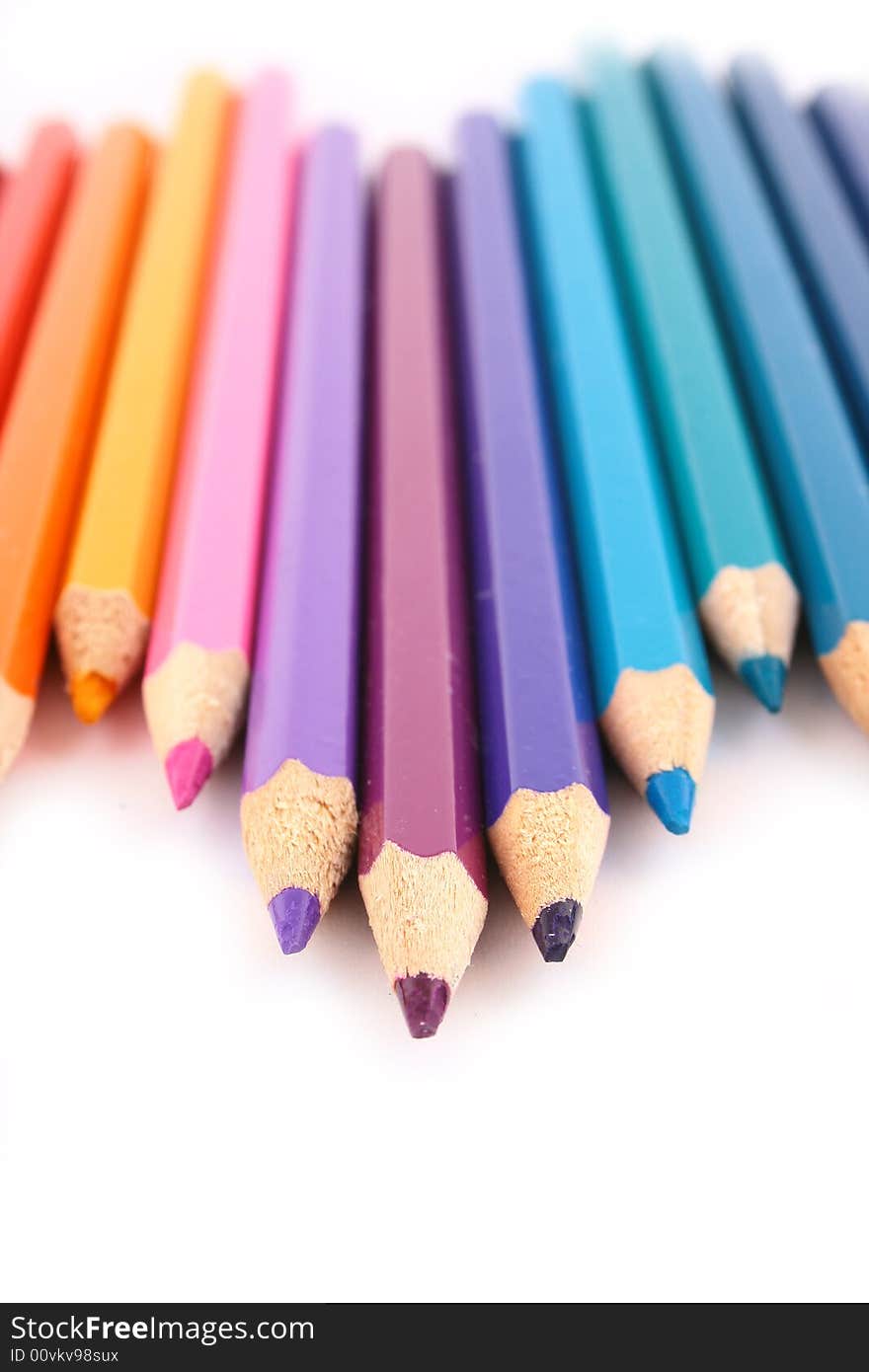 Multicolored pencil on white background