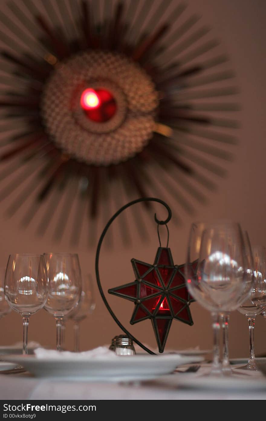 Restaurant table served for fore people Italian style Lamp in red star shape on centre of table. Restaurant table served for fore people Italian style Lamp in red star shape on centre of table