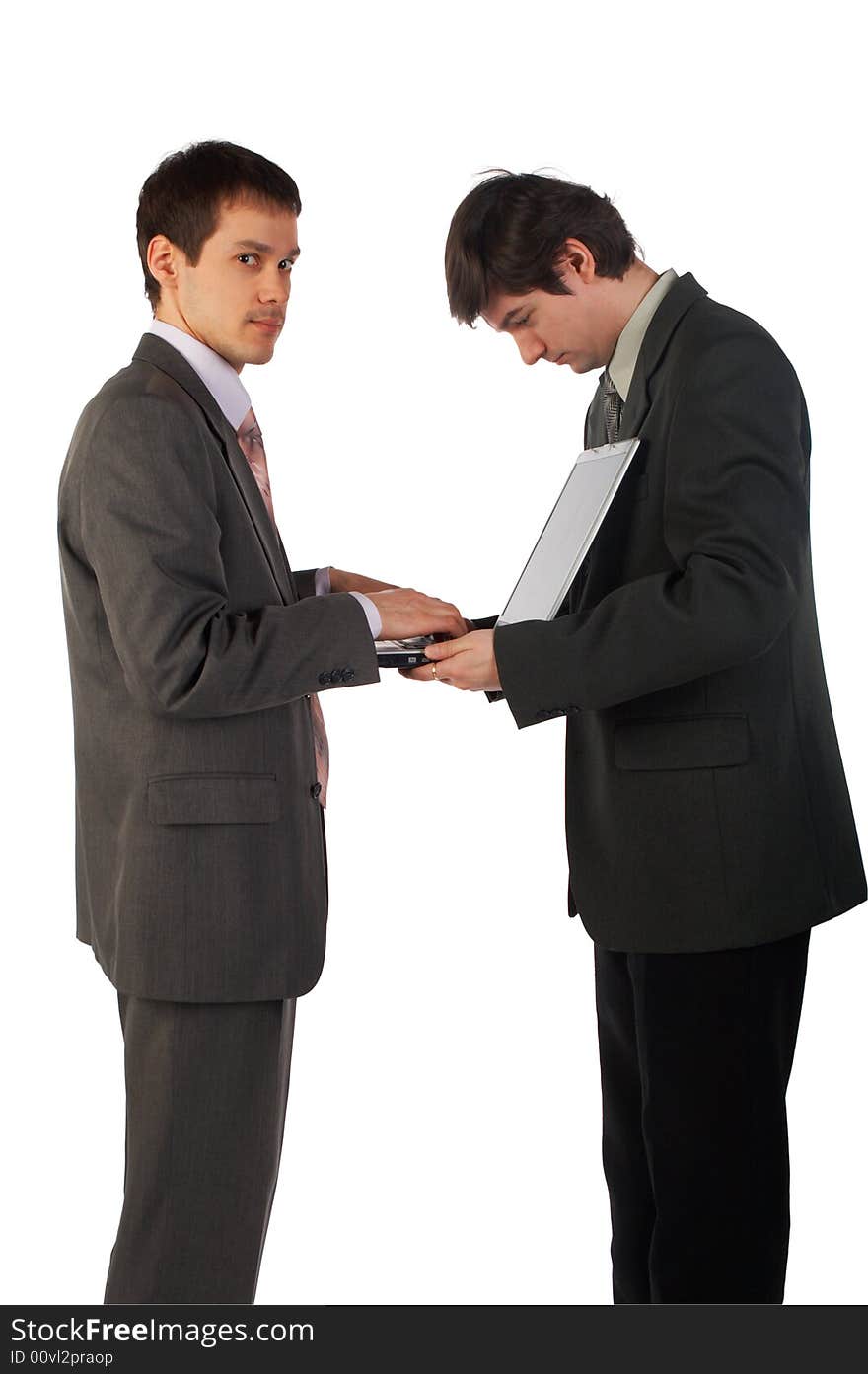 Two young businessmen working isolated on white 2. Two young businessmen working isolated on white 2