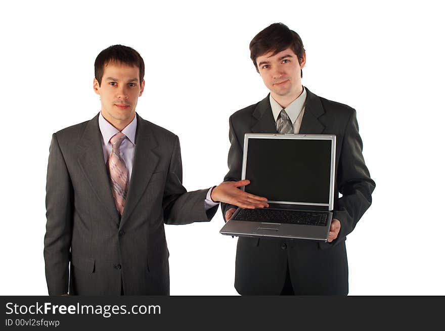 Two young businessmen show laptop