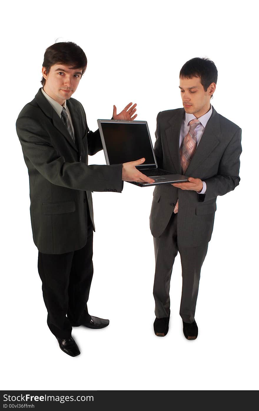 Two young businessmen show laptop isolated on white 4. Two young businessmen show laptop isolated on white 4