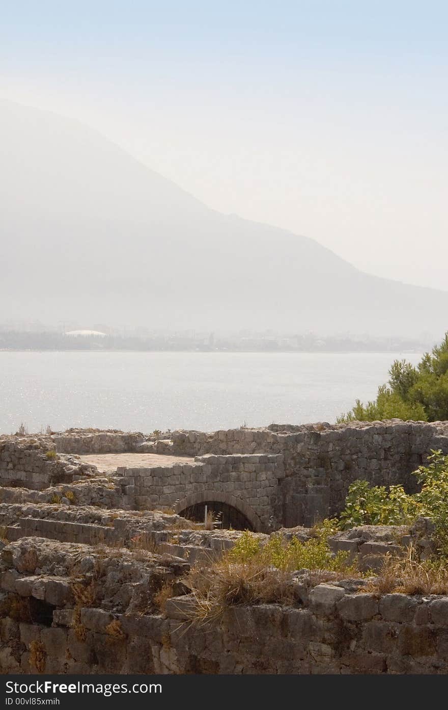 Shot of part of ruins castle on beach of sea Adriatic