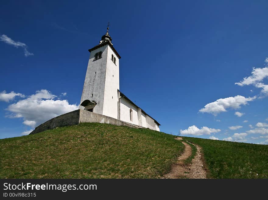 Lonely church on a green hill. Lonely church on a green hill.