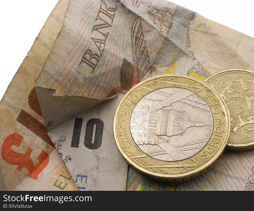 Bank note and coins - scruffy on white background. Bank note and coins - scruffy on white background