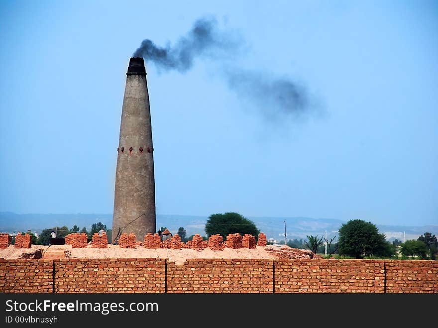 Smoke emitting by brick baking tower. Smoke emitting by brick baking tower