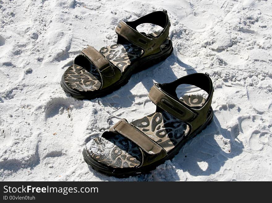 Pair of sandles in the sand