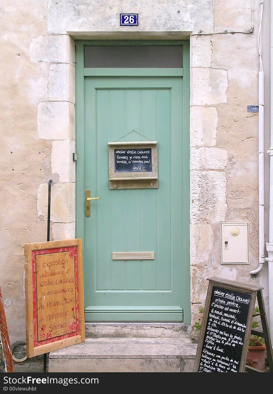 Green Wooden Door With Chalkboards