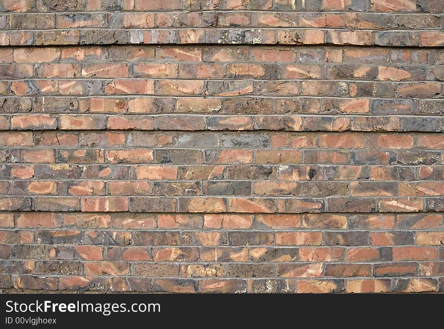 Multi colored brick wall that could be used for a background. Multi colored brick wall that could be used for a background