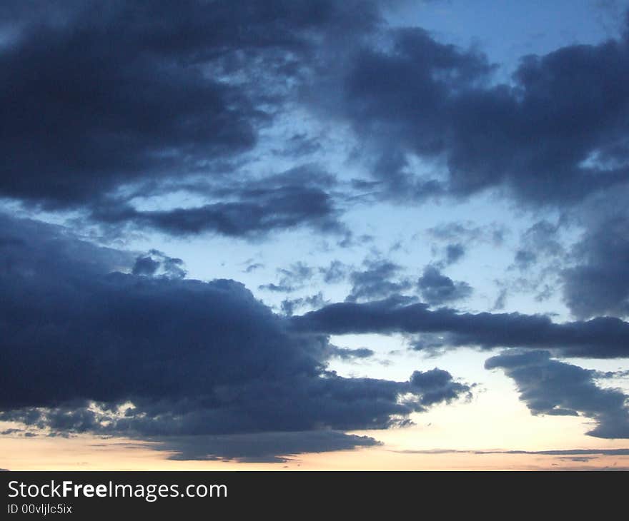 Blue sky with clouds & sun ray