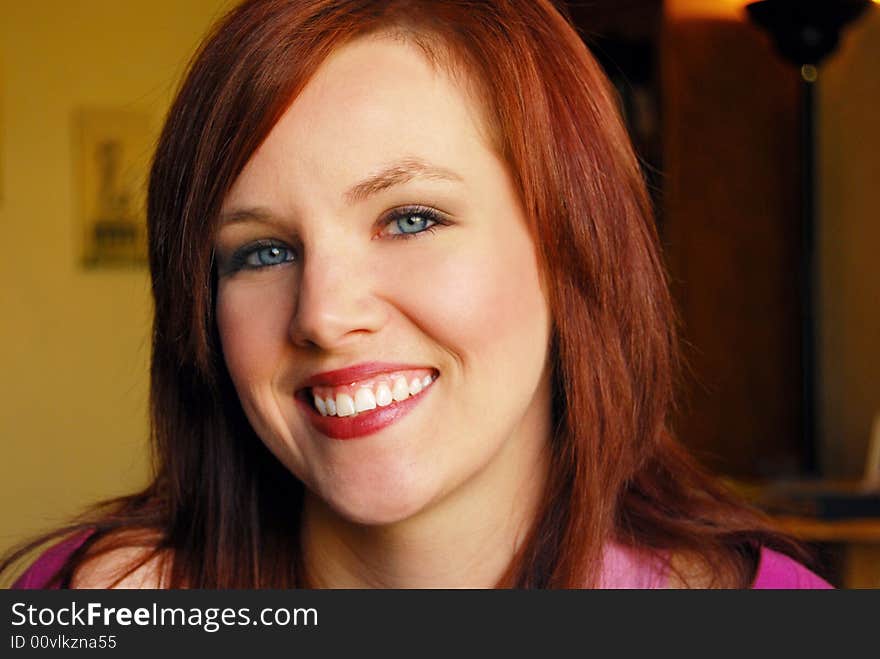 Portrait of young beautiful woman smiling with dark background. Portrait of young beautiful woman smiling with dark background