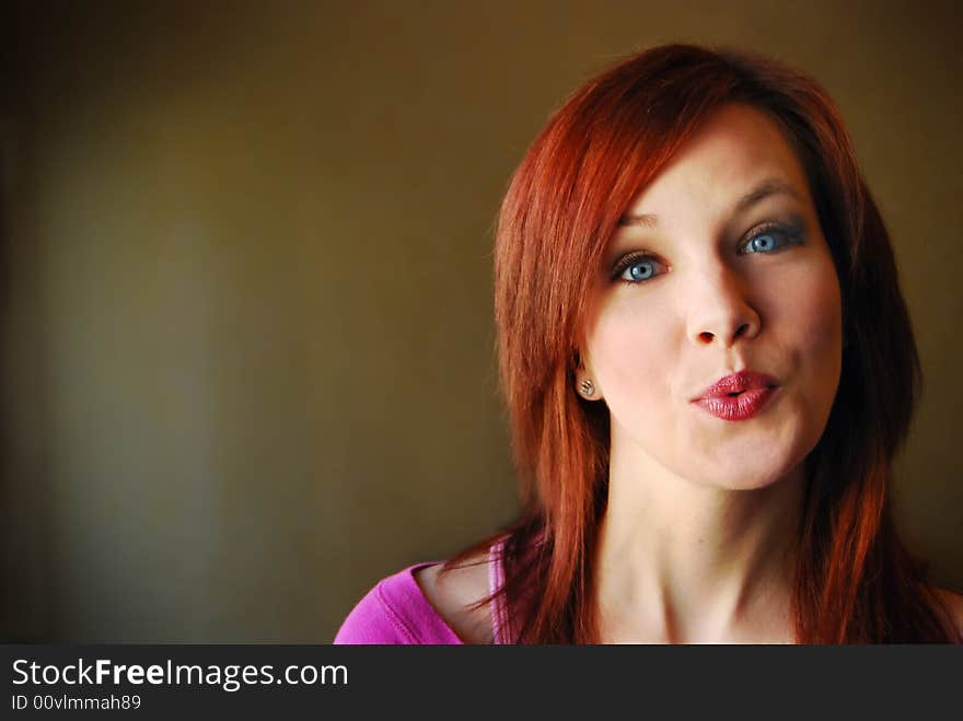 Portrait of young beautiful woman smiling with dark background. Portrait of young beautiful woman smiling with dark background