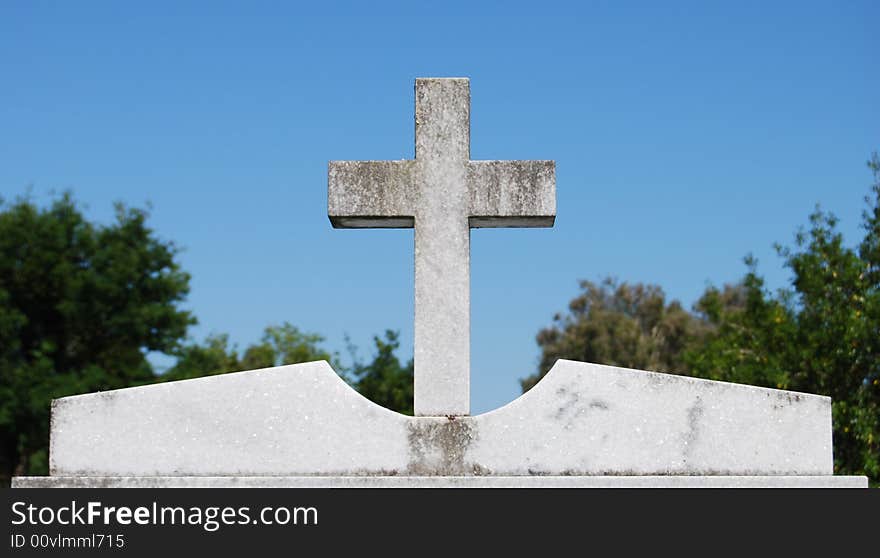 Cross On Top Of Tombstone