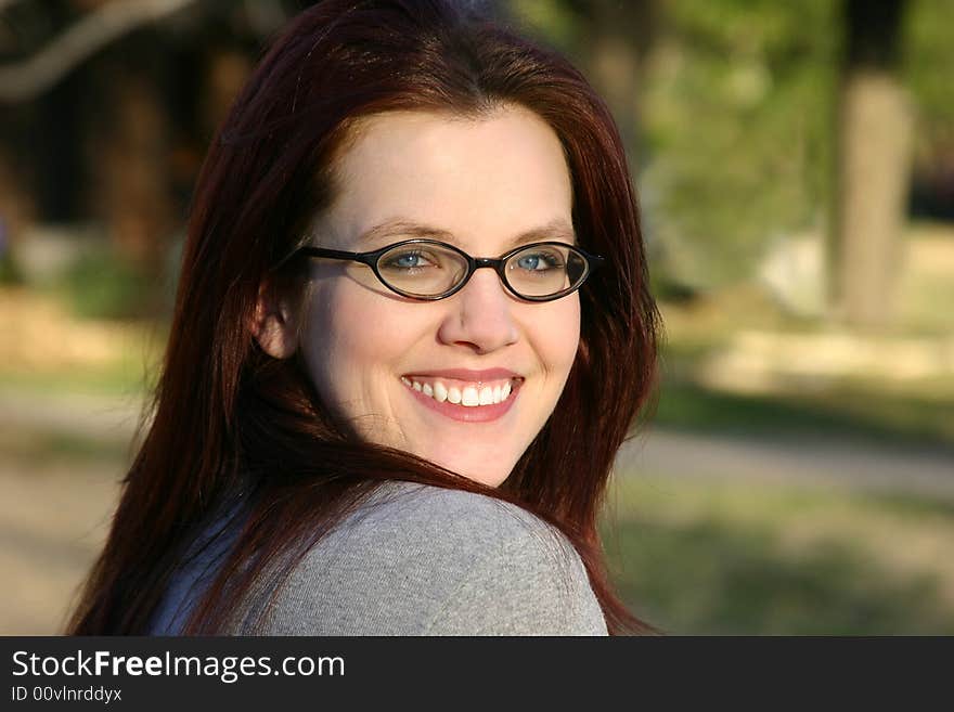 Beautiful young woman in her twenties smiling.