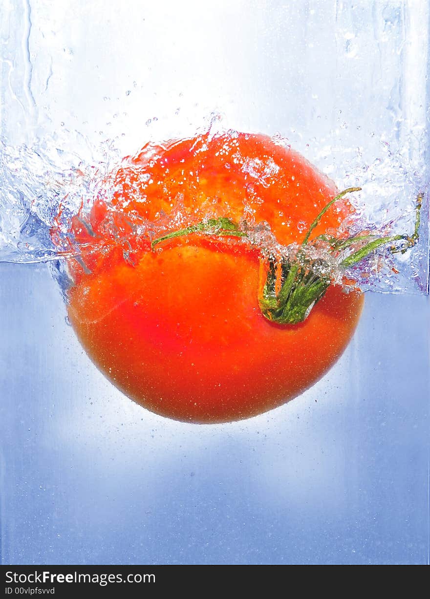 Splashing Tomato Into A Water