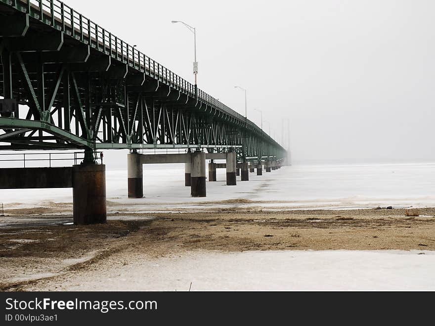 View of bridge from the South shore, with bridge towers fadeing into heavy weather. View of bridge from the South shore, with bridge towers fadeing into heavy weather.