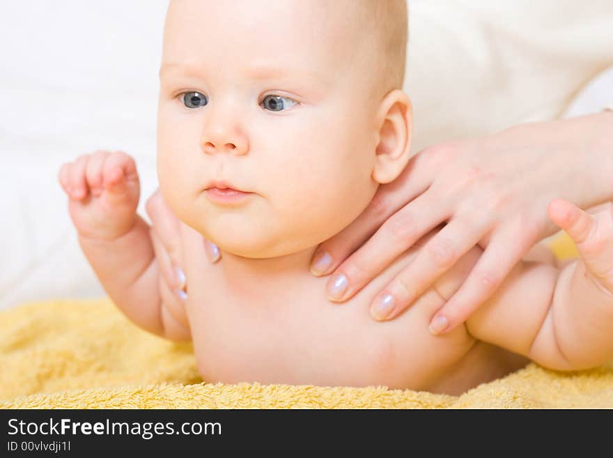 Cute six month baby on yellow blanket. Cute six month baby on yellow blanket