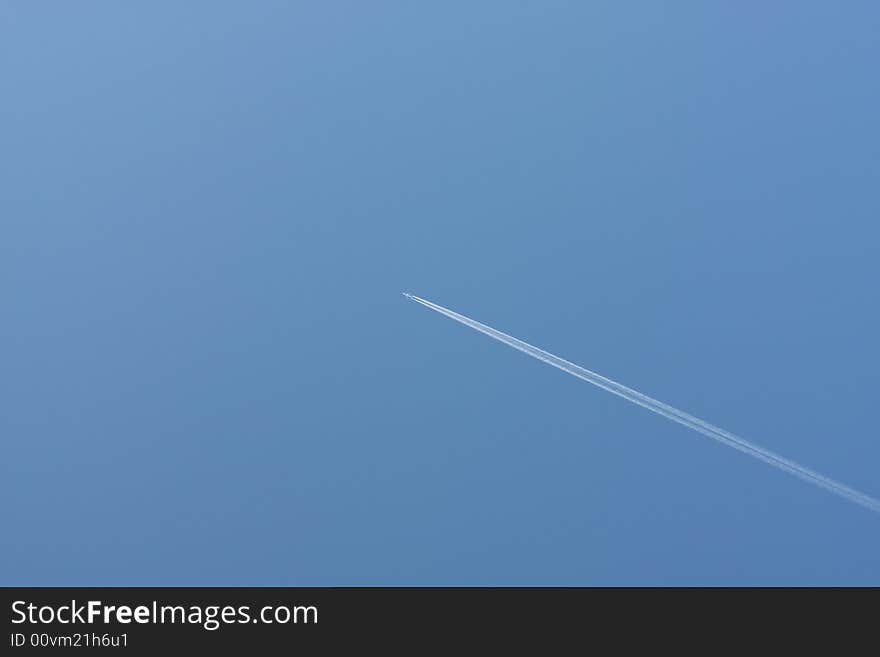 The blue skyand trace from the plane. The blue skyand trace from the plane