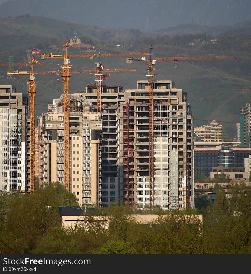 Building site with lot of cranes.