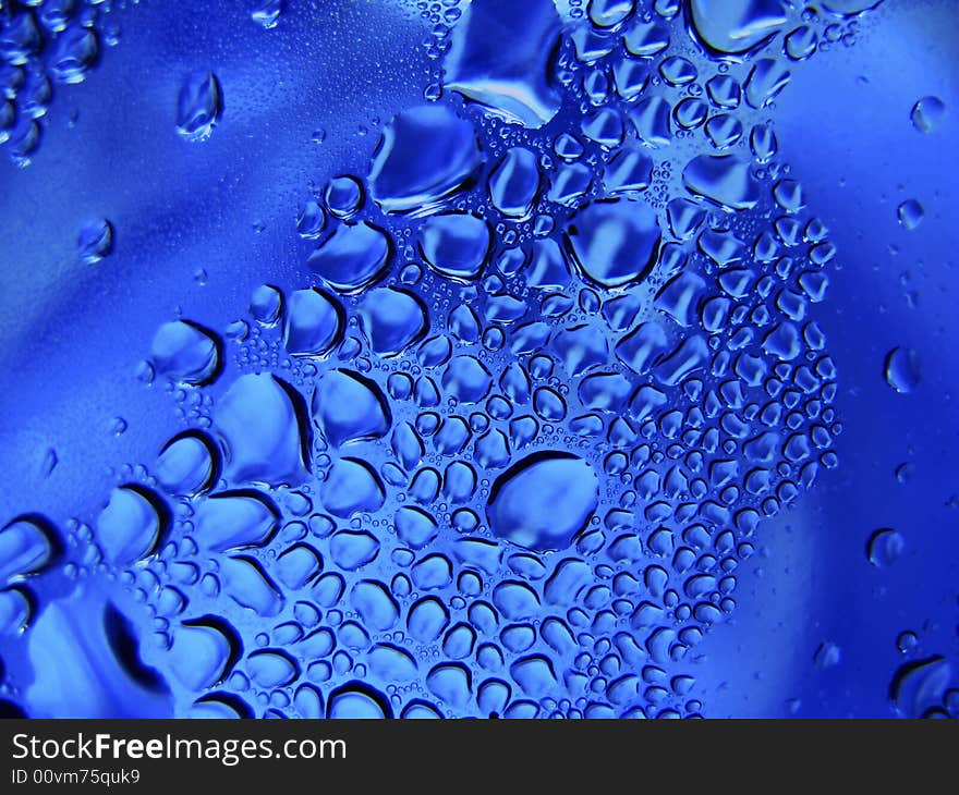 Drops of water on surfaces of plastic,  close up. Drops of water on surfaces of plastic,  close up