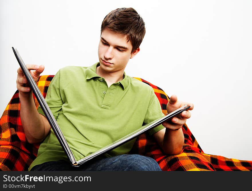 Young handsome man with photograph album