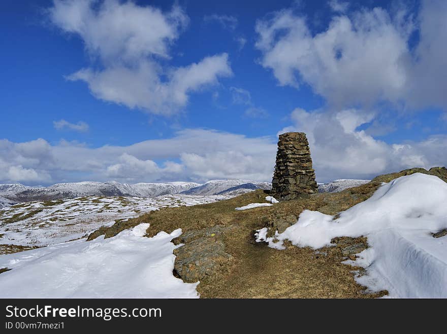 The snow streaked summit and tig point of Brunt Knott, a hill in the English lake District. The snow streaked summit and tig point of Brunt Knott, a hill in the English lake District