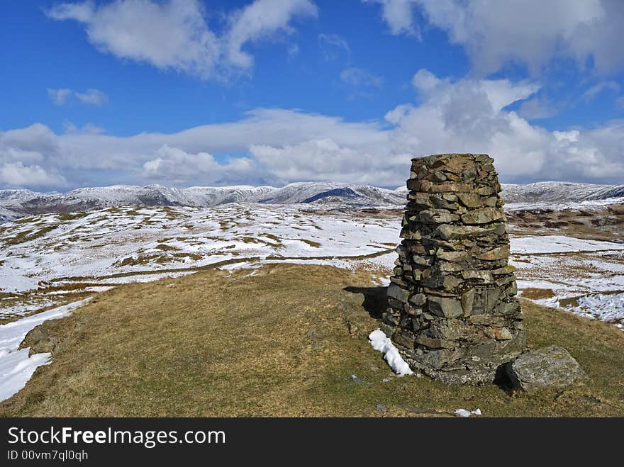 The snow streaked summit and tig point of Brunt Knott, a hill in the English lake District. The snow streaked summit and tig point of Brunt Knott, a hill in the English lake District