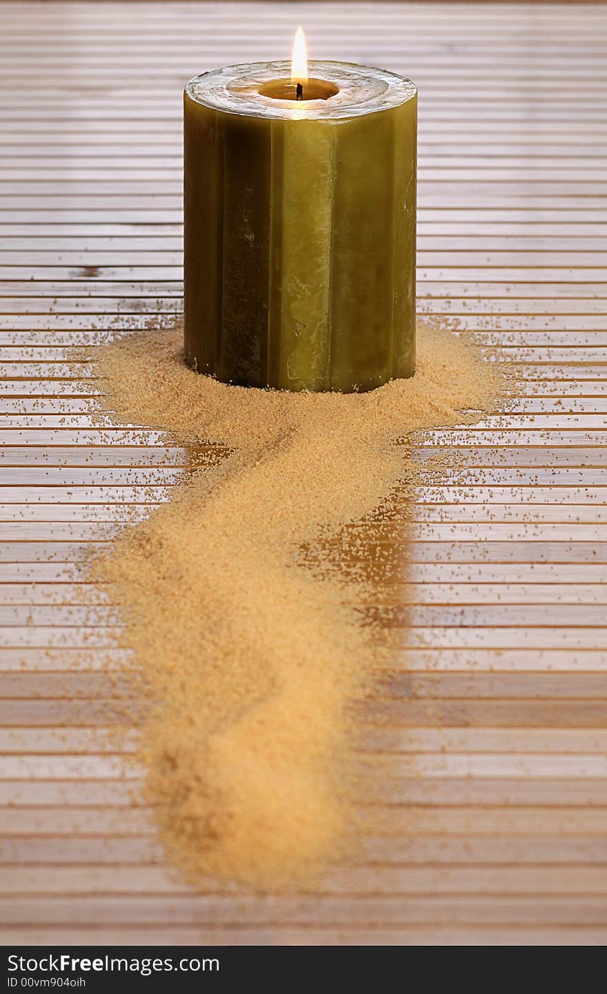 Zen candle over the sand in a spa