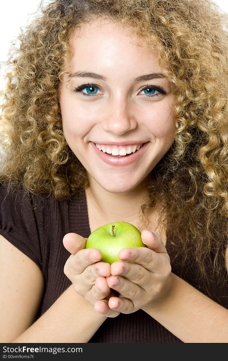 A beautiful young women holding an apple