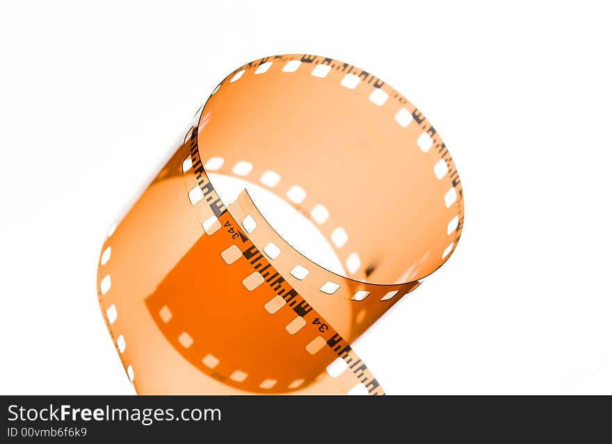 35 mm film strip rolled on white background. 35 mm film strip rolled on white background