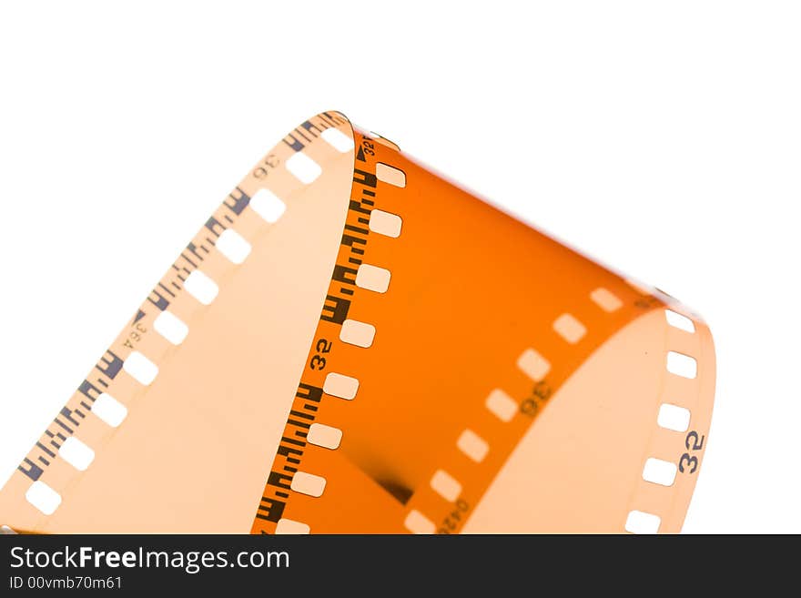 35 mm film strip rolled on white background. 35 mm film strip rolled on white background