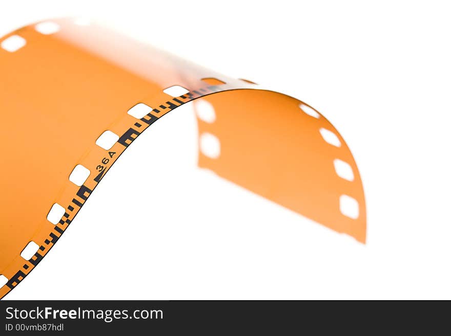 35 mm film strip rolled on white background. 35 mm film strip rolled on white background