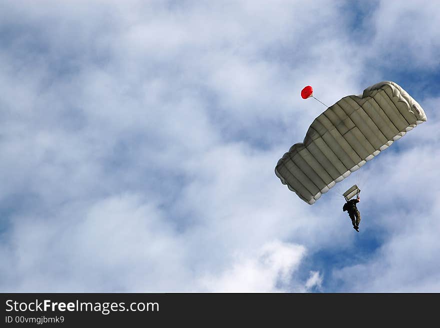 Two Parachutist solider on blue sky