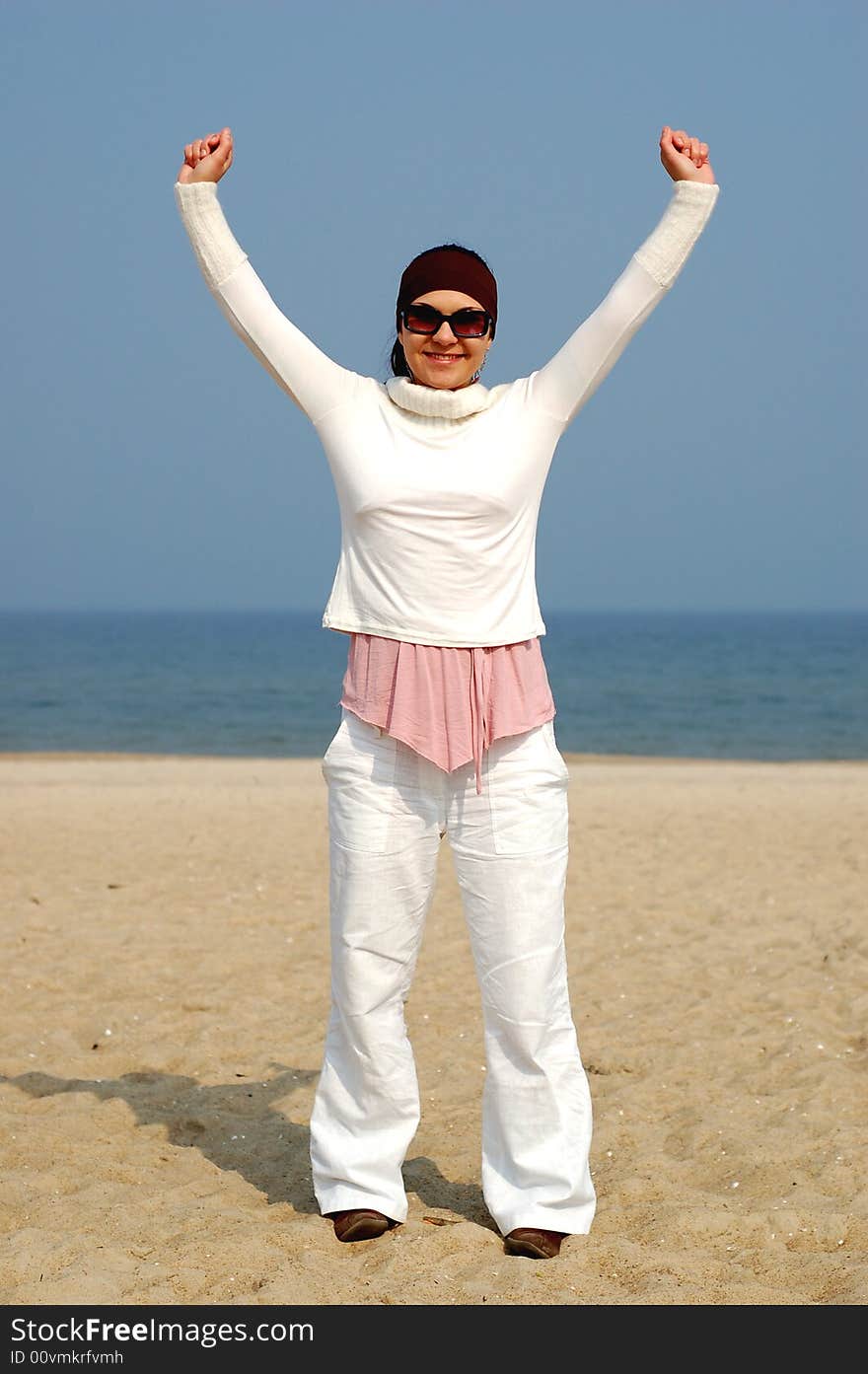 Attractive brunette woman on the beach. Attractive brunette woman on the beach