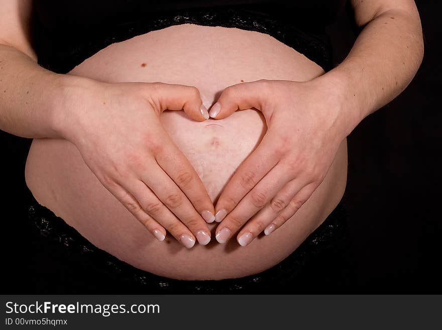 Hands on pregnant belly